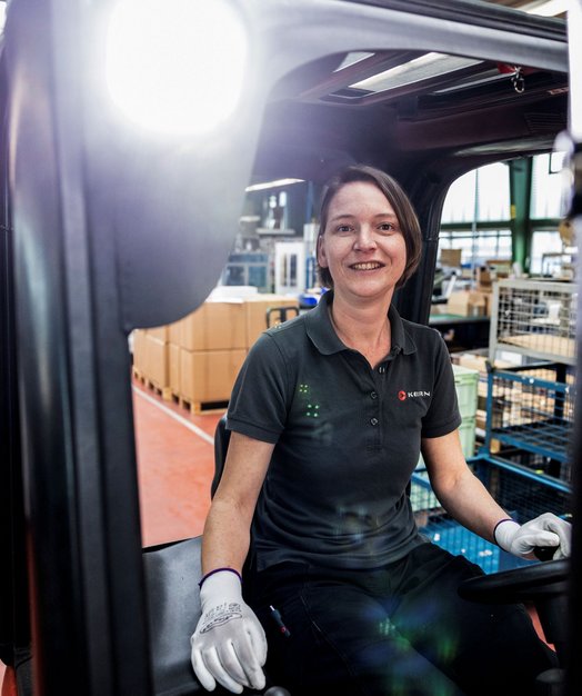 Employee drives forklift truck at Kern Motion Technology