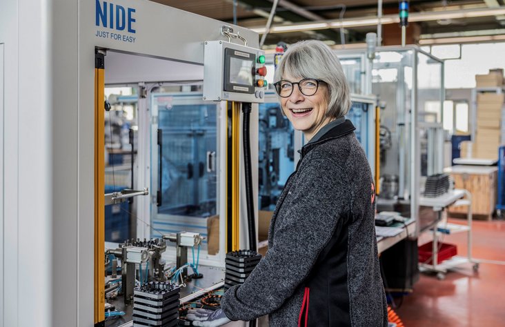Employee operates machine in production facility at Kern Motion Technology