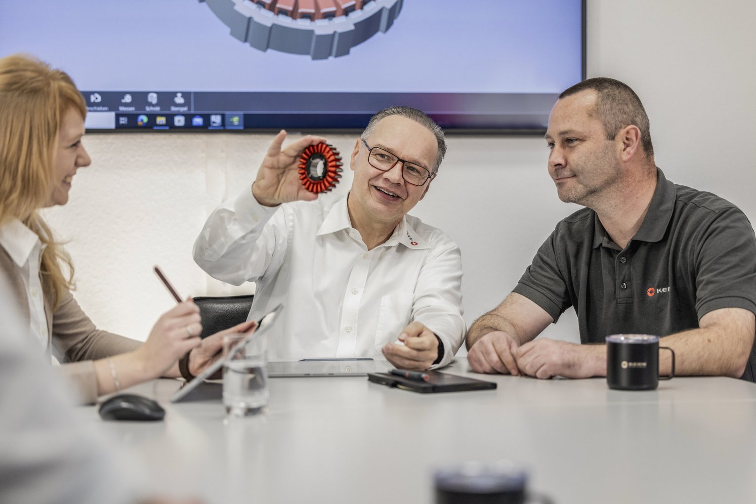 Meeting involving three staff members at Kern Motion Technology